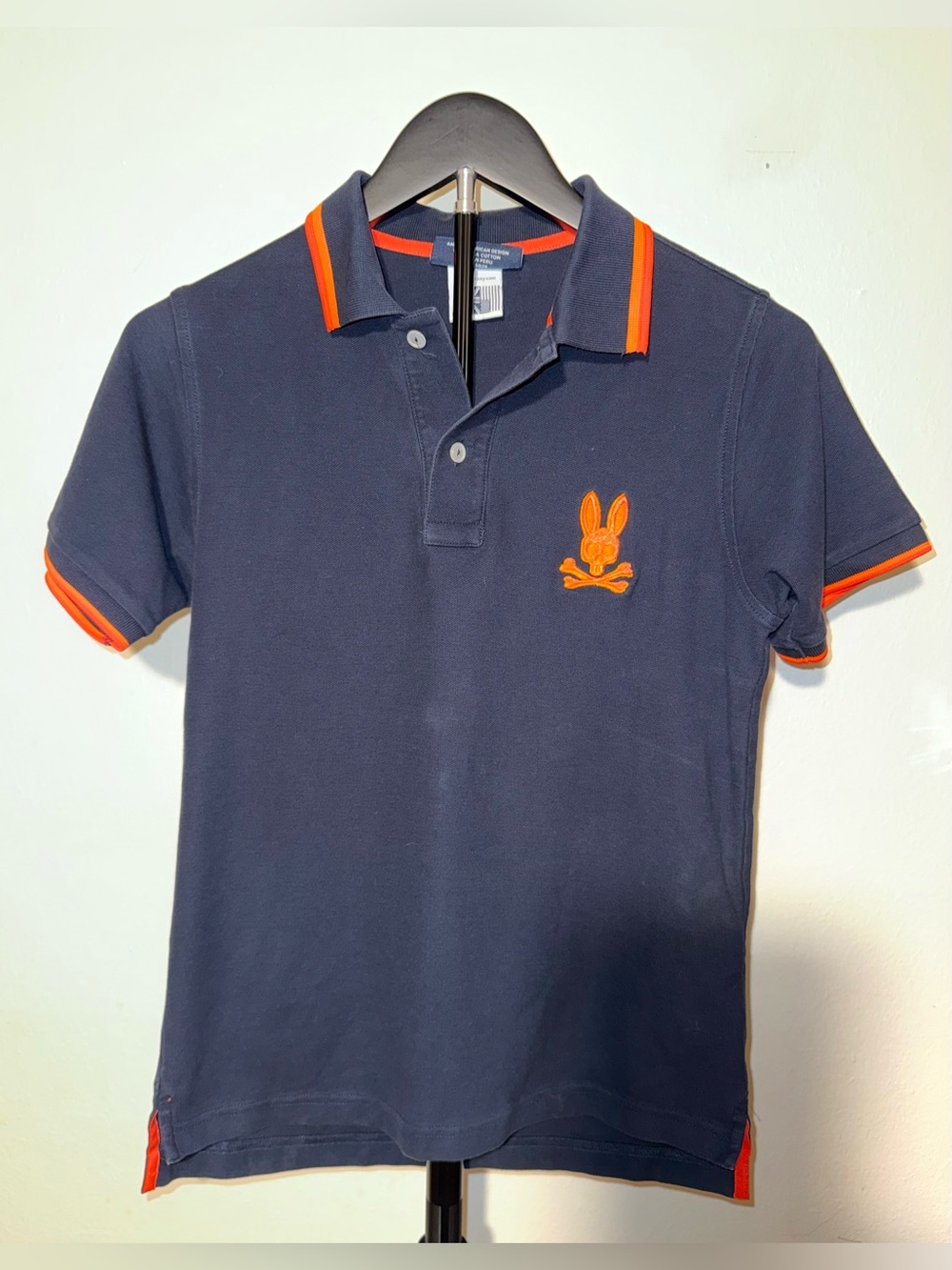 Psycho Bunny Navy Pima cotton piqué polo with orange trim and logo, size 14/16